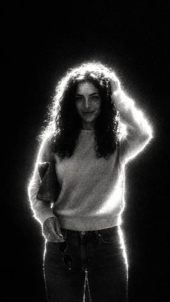 Extreme backlight and clipped highlights with coarse grain and crushed blacks.